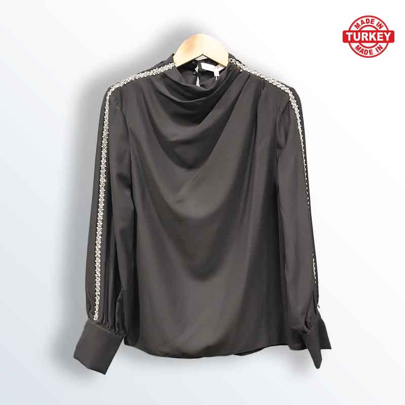Turkish blouse with a plunging neckline and rhinestones on the edges